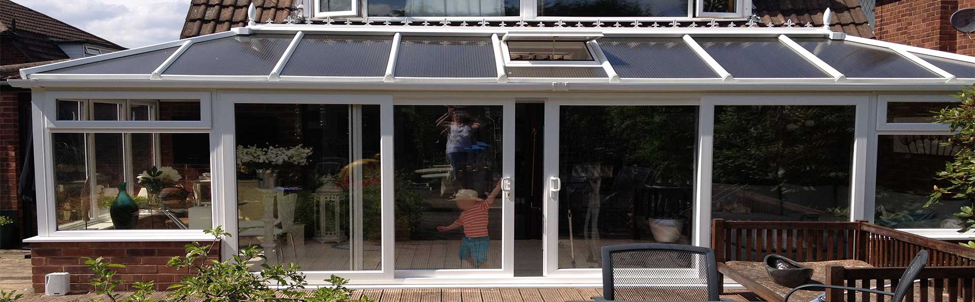 Completed white conservatory with glass roof